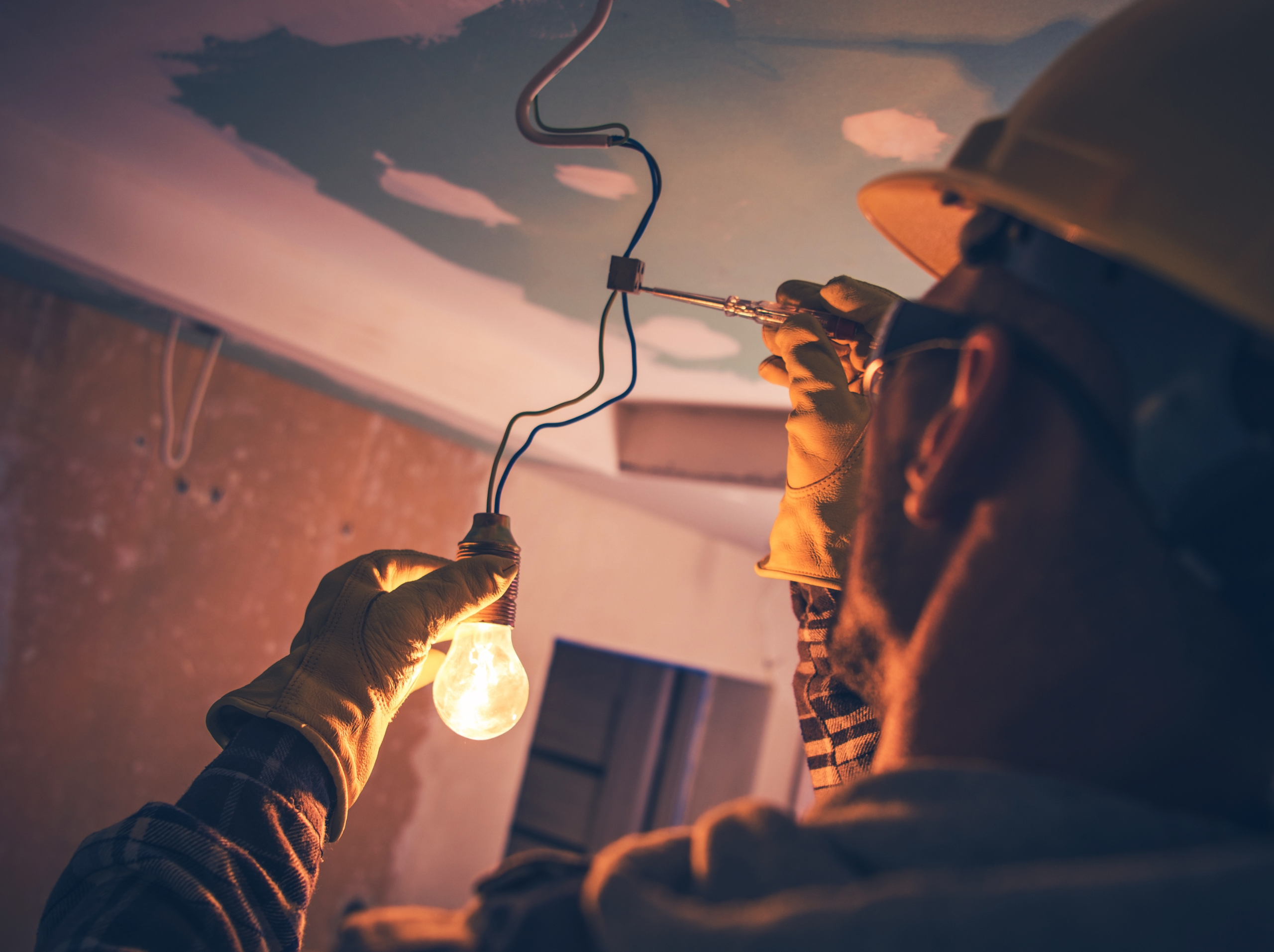 Electrician diagnosing home electrical issue